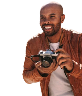 male-tourist-holding-a-with-camera