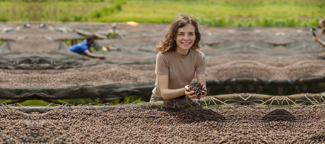 Tourist-in-dried-coffee-beans-African-Farm